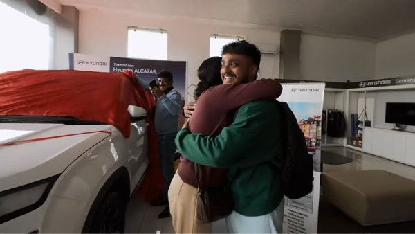 son gifts car to parents