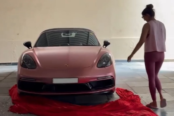 actress varalakshmi receives porsche 718 boxster sports car