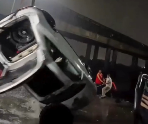 woman drives audi q3 luxury car into creek