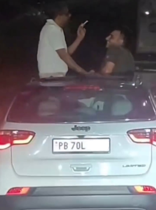 youths smoke cigarettes out of sunroof of jeep compass car youths smoke cigarettes out of sunroof of jeep compass car