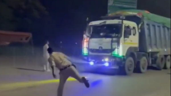 Cops Throw Stones At Moving Trucks