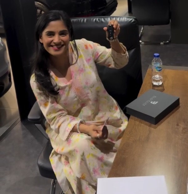 young indian woman bought second-hand porsche 911 carrera s in dubai