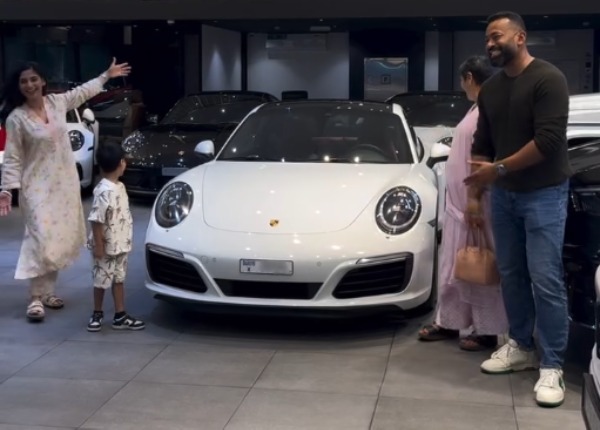 young indian woman bought second-hand porsche 911 carrera s in dubai