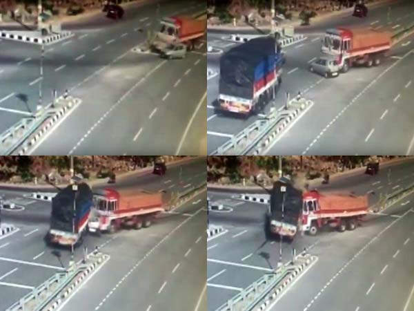 రెండు భారీ లారీల మధ్య భీకరంగా నుజ్జునుజ్జైన కారు