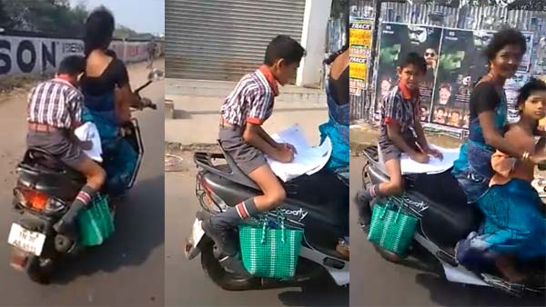 కదిలే స్కూటర్ మీద హోమ్ వర్క్ చేస్తున్న పిల్లాడు కదిలే స్కూటర్ మీద హోమ్ వర్క్ చేస్తున్న పిల్లాడు