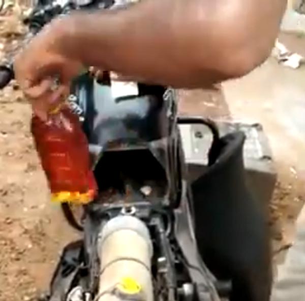 బైక్ కింద నుంచి 20 బాటిల్స్ మద్యం స్వాధీనం, వీడియో చూస్తే మీరు కచ్చితంగా షాక్ అవుతారు