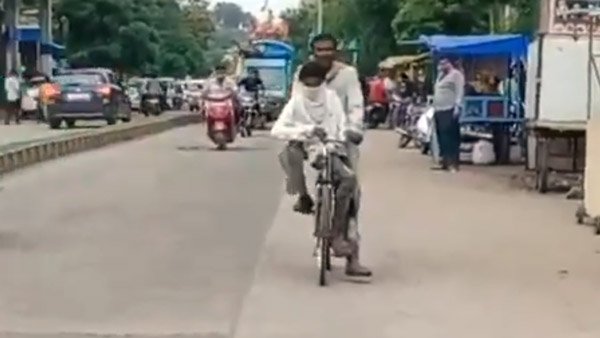 కొడుకు పరీక్ష రాయించడానికి 105 కి.మీ సైకిల్ పై తీసుకెళ్లిన తండ్రి
