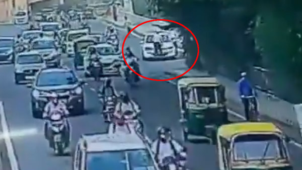 కారు బోనెట్ మీద పడిన పోలీస్.. పట్టించుకోకుండా కార్ డ్రైవింగ్, చివరికి ఏమైందంటే ?