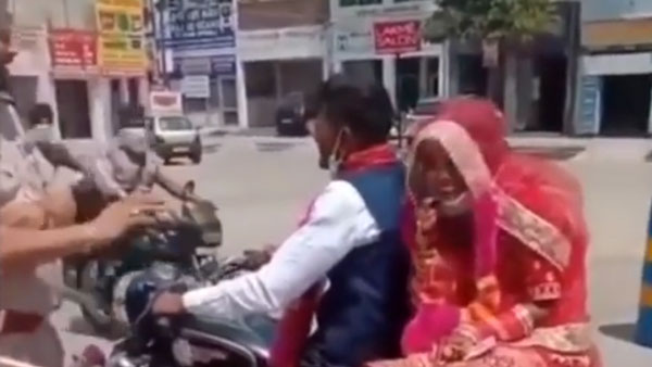 లాక్‌డౌన్ లో రోడ్డుపై కనిపించిన కొత్త జంట మెడలో పూల మాలలు వేసిన పోలీసులు[వీడియో]