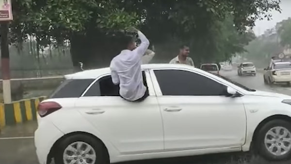 జోరువానలో ప్రమాదకరంగా కారులో ప్రయాణించిన యువకులు; రూ. 62,000 ఫైన్