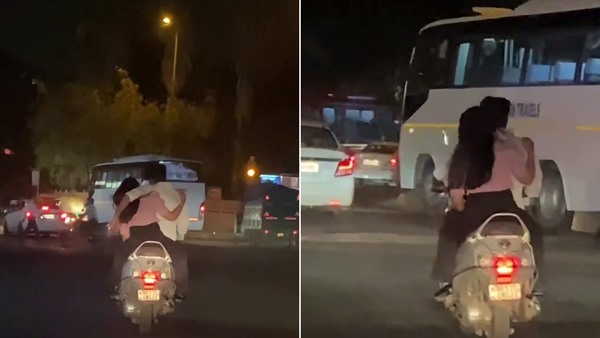 couple hugging while riding in delhi