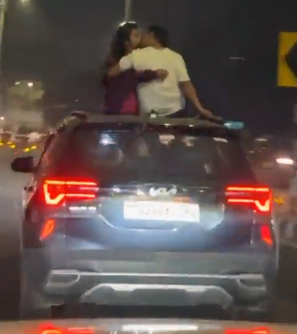Hyderabad couple kissing on car sunroof