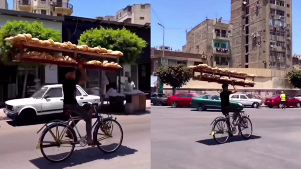 Man-Rides-Cycle-With-Bread-Rack