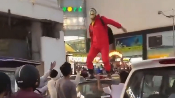 Man-Showering-Cash-On-Public