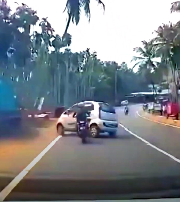 Tata nano car loses control and hits coconut tree and bike