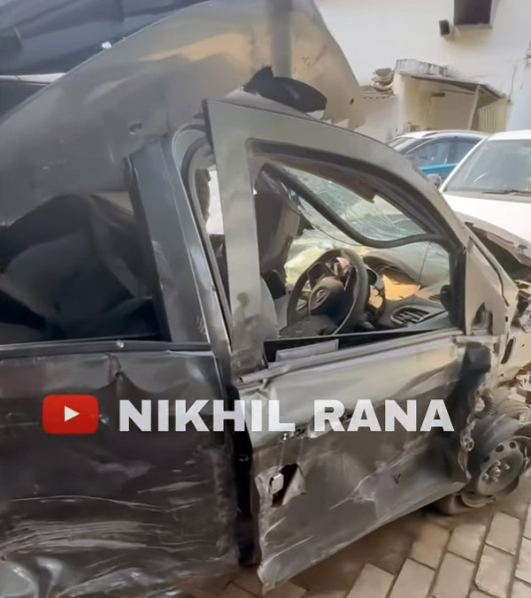 Tata Tiago car crushed between two trucks news
