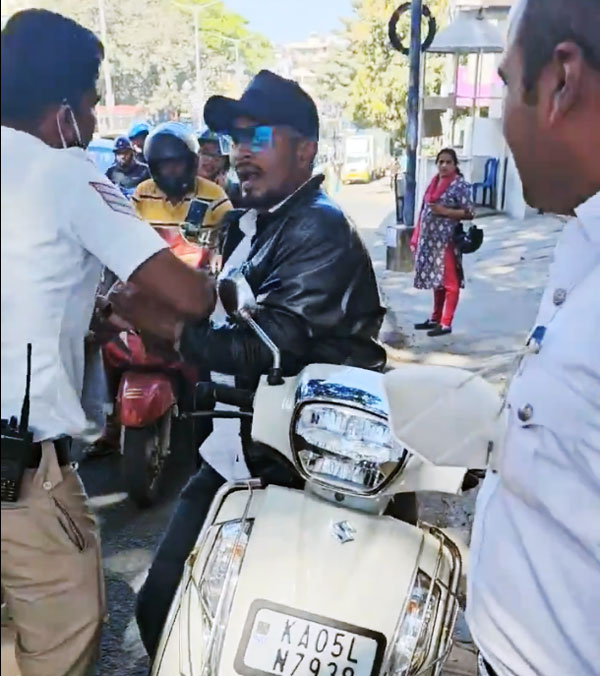 Bengaluru Man Bites Traffic Police Hand