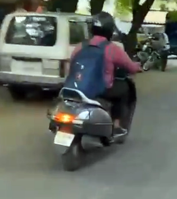 Man Riding Scooter And Attends Office Video Conference in Laptop