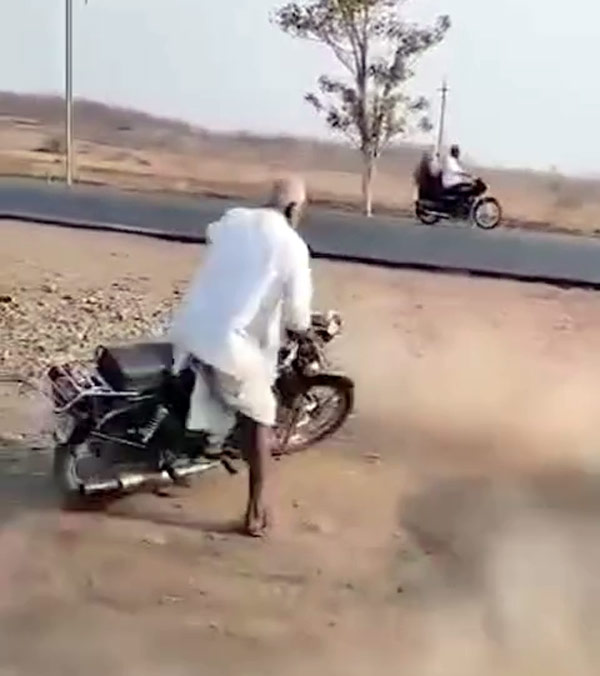 Old Man Doing Stunt On Royal Enfield