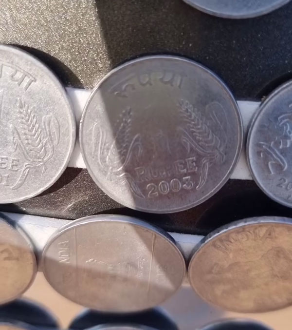 Swift Dzire car Pasted With One Rupee Coins