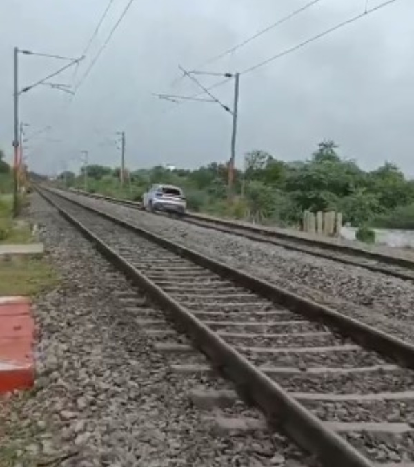 Woman Drives Car On Railway Track Trains Late